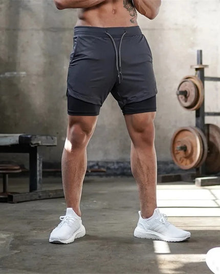 FUSION-shortsit - Tummanharmaat treenishortsit miehille