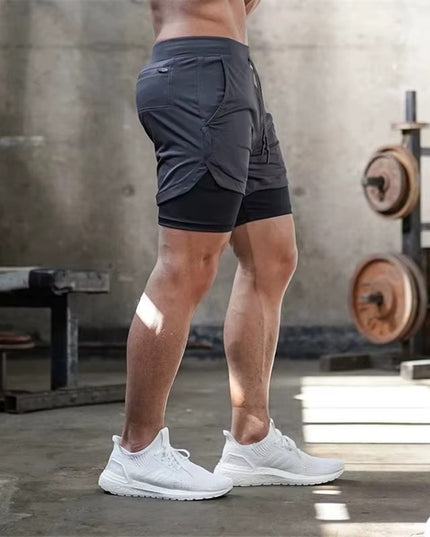 FUSION-shortsit - Tummanharmaat treenishortsit miehille